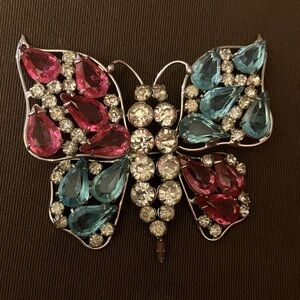 Elegant Butterfly Brooch with Pink and Blue Rhinestones.